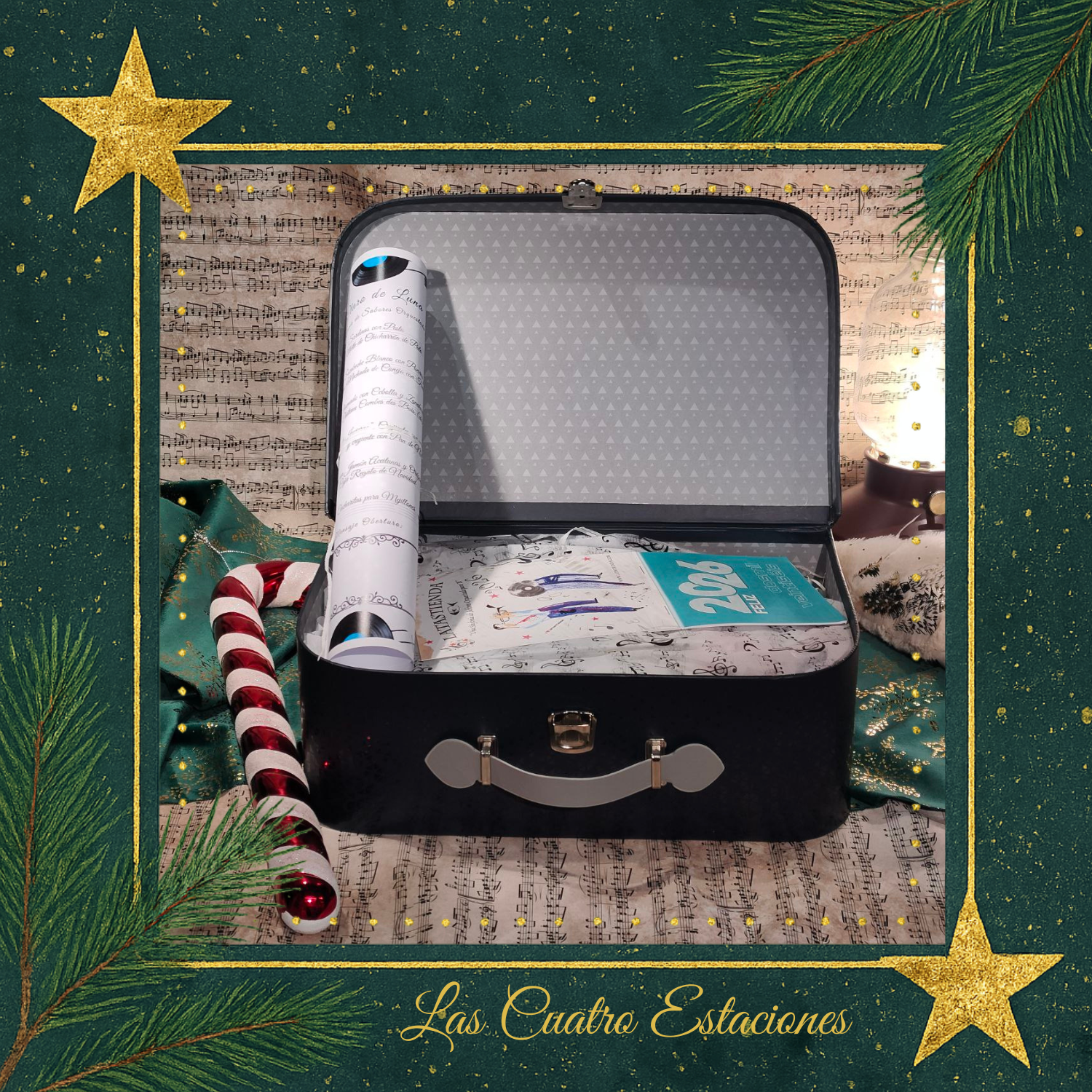 Cesta regalo Navidad presentación detalle de la presentación de la maleta gouremt las cuatro estaciones