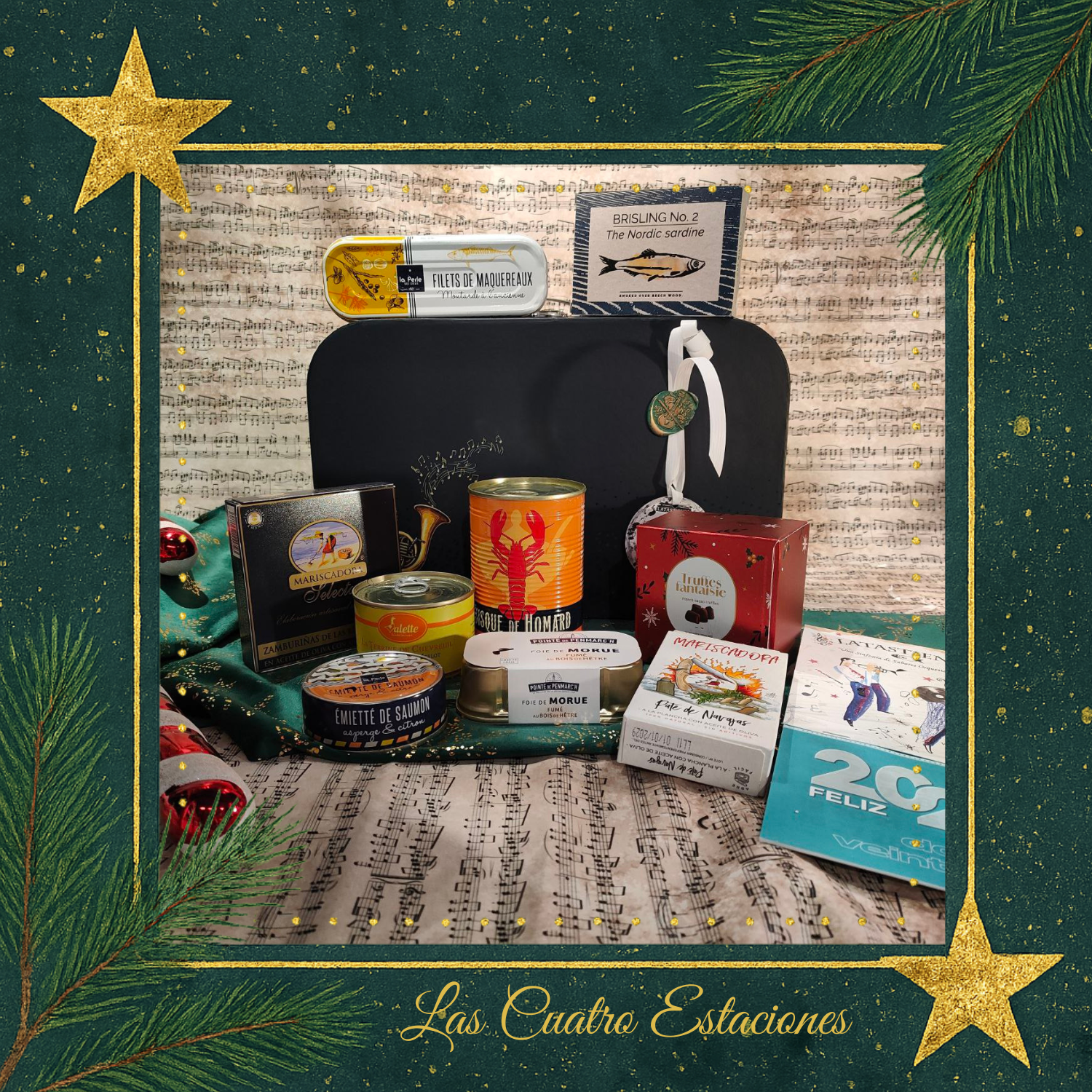 Cesta regalo de Navidad Cuatro estaciones abierta cesta regalo de navidad con los productos expuestos donde vemos conservas de pescado gourmet